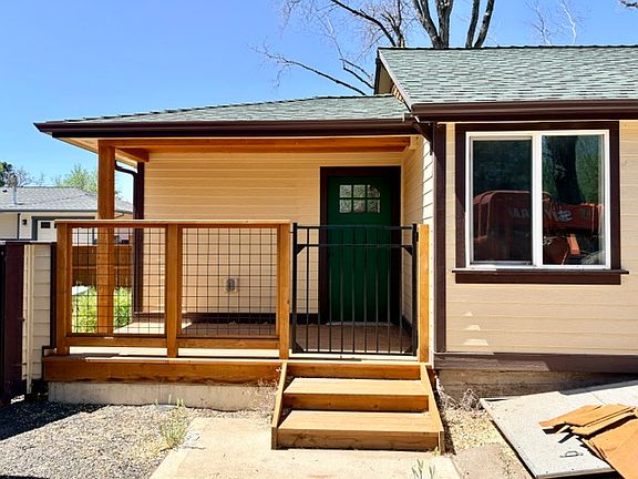 Side room entrance and porch from driveway.