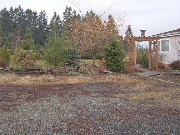 Trellised yard with low rail fencing