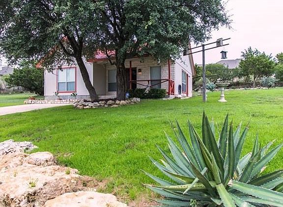Another view of exterior of home from street.