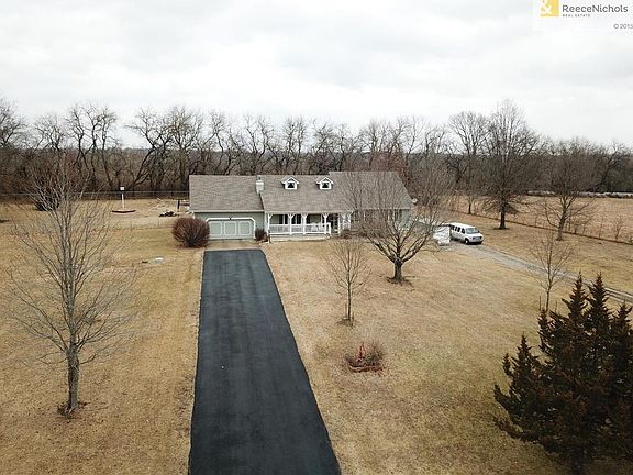 You should see this place when the foliage is out!  ABSOLUTELY BEAUTIFUL!  2 front entry garages.  1 on the side that's attached and a detached garage behind house.