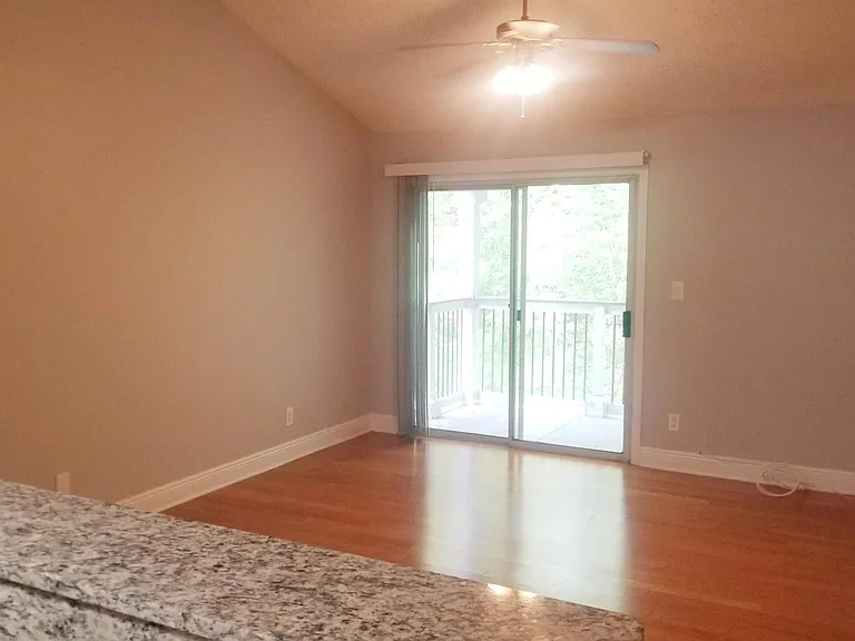 View of Living Room and Patio Balcony from Kitchen