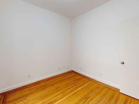 Bedroom with a wood-like flooring