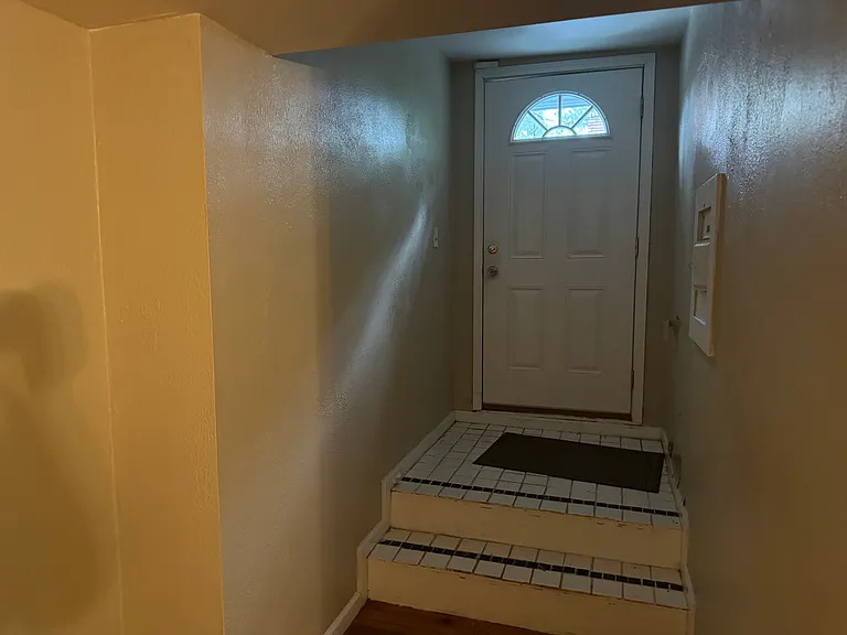 This door leads out to a flat roof - it's not for walking/hanging out on, but is meant for bringing in large items that can't fit up the spiral staircase