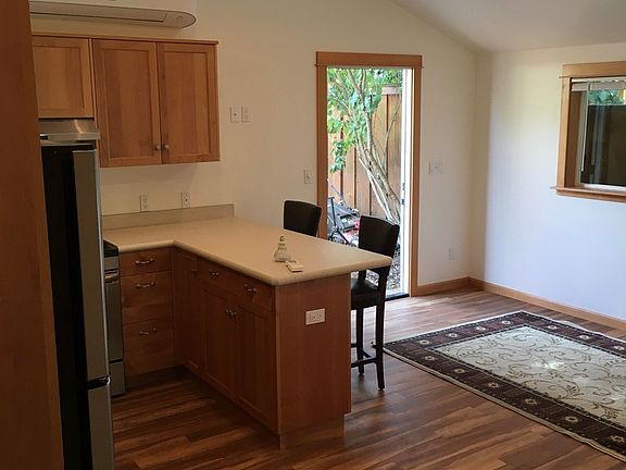 Front door, living room, kitchen