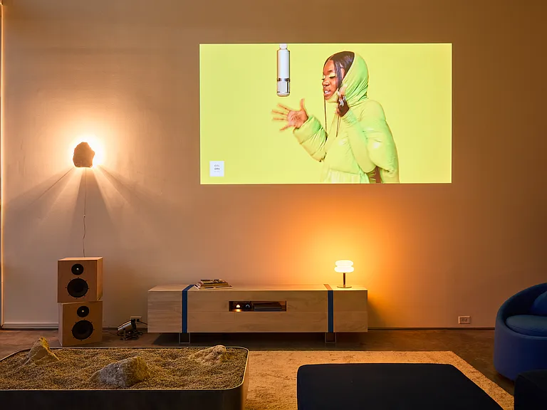 Living room - pictured at night with art deco lamps and projector TV