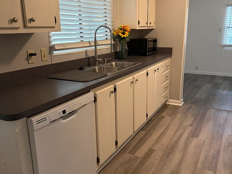 Kitchen features a deep sink with garbage disposal and and chef's faucet