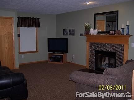 Family Room
						:
						Wood Fireplace with new slate and glass hearth.
