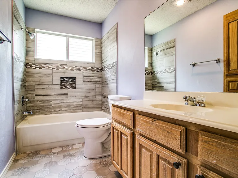 Bathroom 2 with decorative tile and tub too.