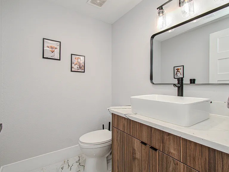 Convenient powder room located just off the main living area, providing easy access for guests and added comfort during your stay.