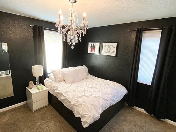 1st bedroom. This room will have new flooring and WHITE walls when rented (updated photo coming soon).