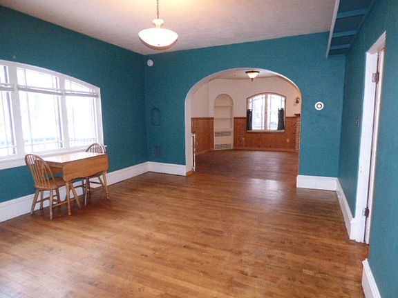On the other side of the living room is the large dining room. The dining room is at the center of this home. 