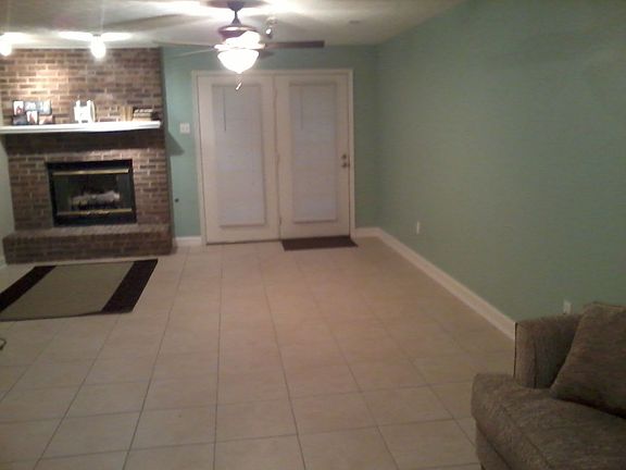 Tiled with great fireplace!