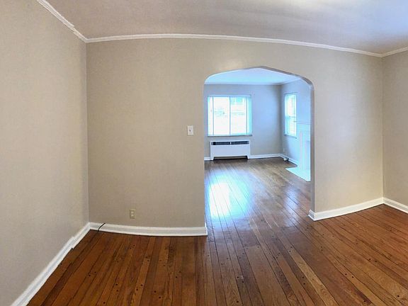 Dining room looking into living room. Large closet on left.