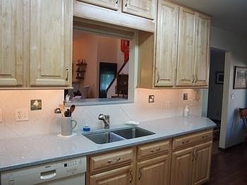 Maple cabinets and Quartz counters in this efficient kitchen.