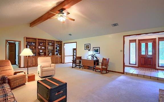 Yes please come into the "ponderosa" size living area  Built in book cases. Lots of room for antiques.. Or large enough to make two separate sitting areas.