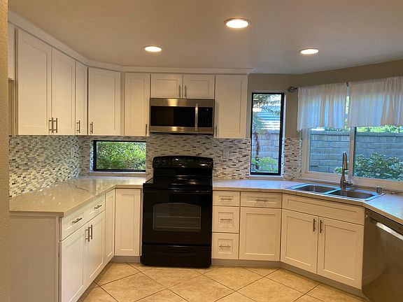 Brand new kitchen with Quartz countertop, soft closing cabinet with backsplash. Stainless steel appliances with 2 year new stovetop.