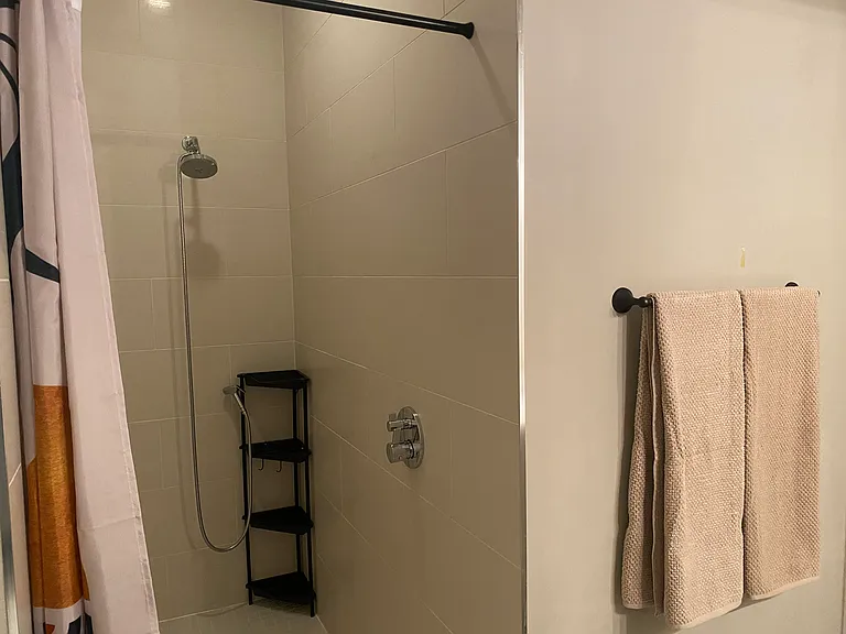 2nd floor, hall bath, full-tile step-in shower.