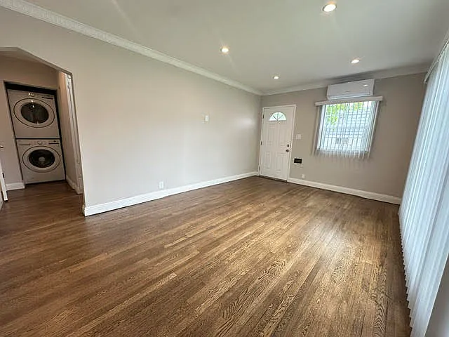Living Room. Newly redone hardwood floors. New blinds