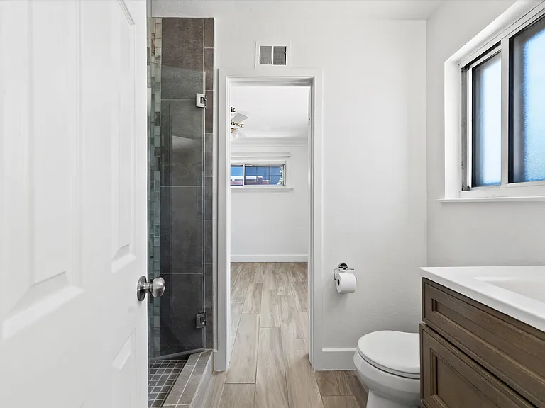 Jack and Jill bathroom. Walk in rainfall shower Plenty of natural light