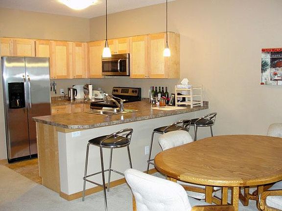 Fantastic kitchen with maple cabinetry, new stainless steel appliances and large peninsula counter.