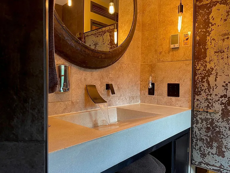 Brickhouse Bathroom with Waterfall Faucet & Radiant Floor Heat
