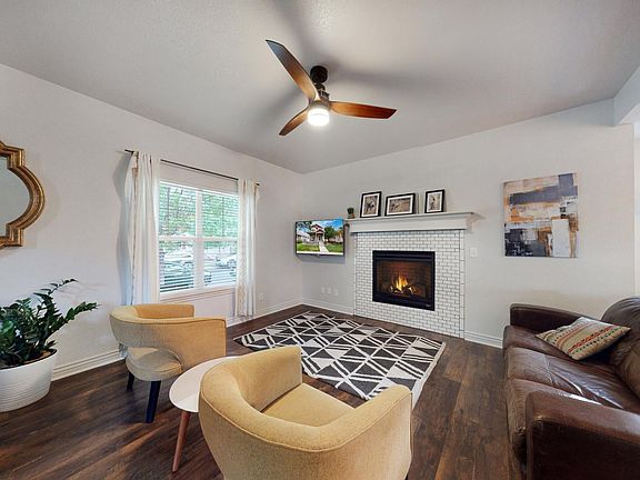 Cozy up by the fire in this inviting front sitting area