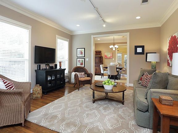 Living room looking towards dining room and kitchen. Hardwood floors, recessed lighting, and great n