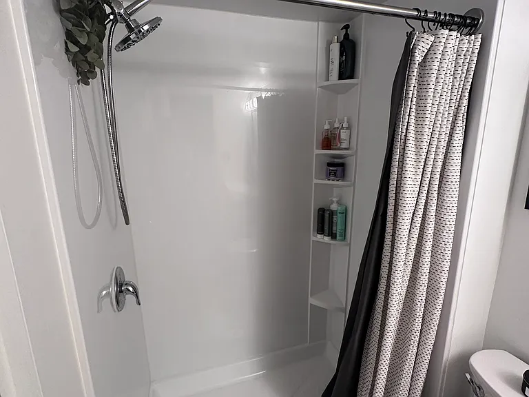 Shower with built-in shelving