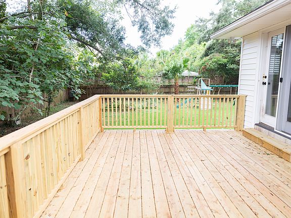 New side deck leading down to large backyard