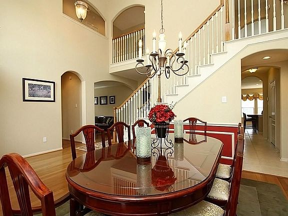 This stunning dining room has an open and airy feel... not your average cookie-cutter home here! You