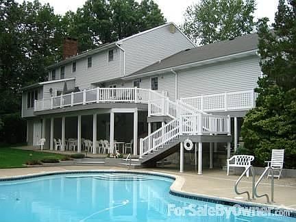 View of rear of the house from backyard : Good photo of the no-maintenance deck