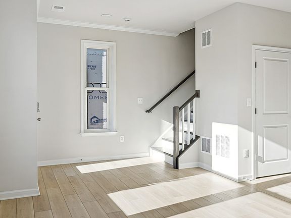 Entry way and flex space with hardwood floors in Clifton II Floorplan at the Vista Gardens West Comm