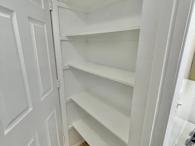 Linen closet inside bathroom
