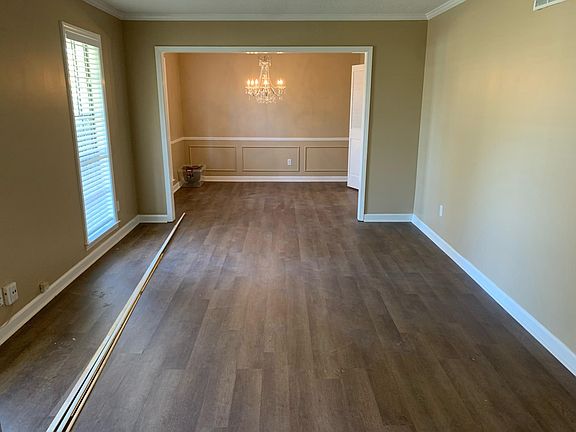 Formal dining room or office space and living room.