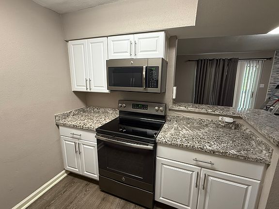 Granite countertop, microwave/oven setup