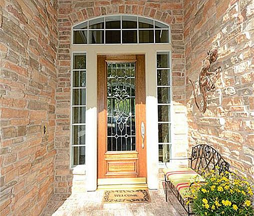 Entry features upgraded bricked porch