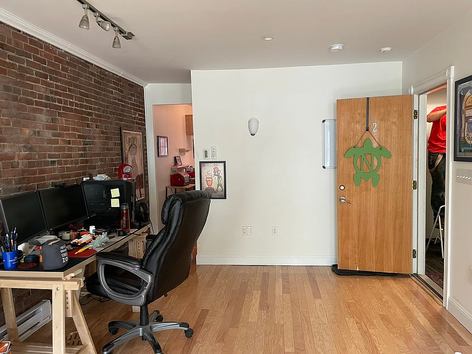Living room zone. Note: mural has been removed.