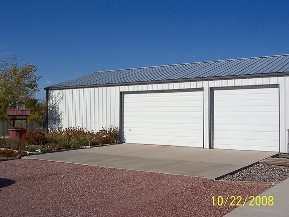 Huge detached garage with ample storage and workshop