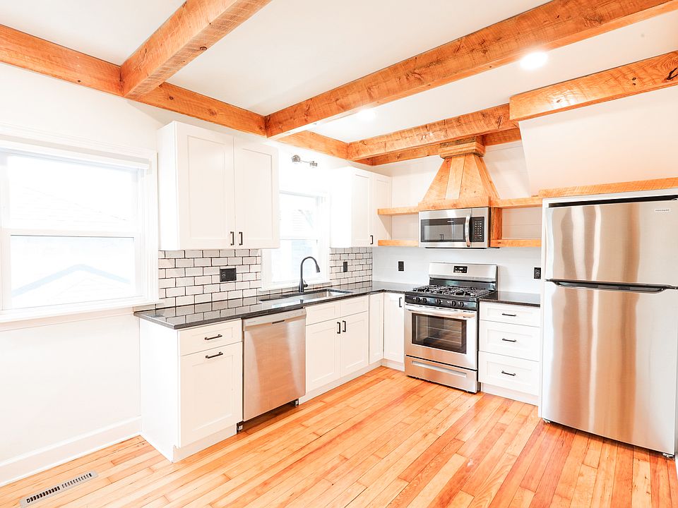 Kitchen- granite countertops, gas range cook top, dishwasher, microwave vents outside, stainless steel appliances