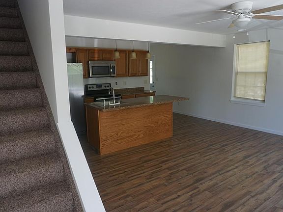 View of living area + Kitchen