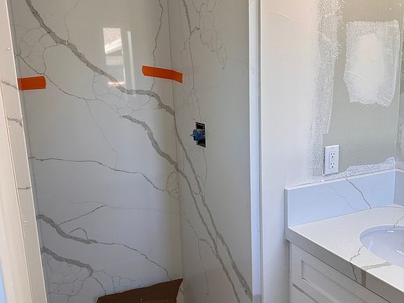 Master bath shower ( cardboard on floor)