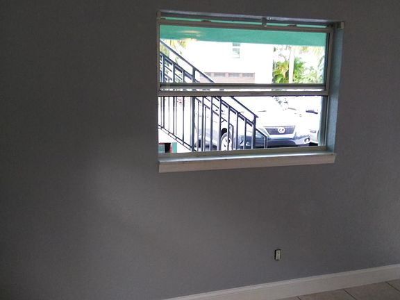 Living Room. Blinds (not pictured here) are included.