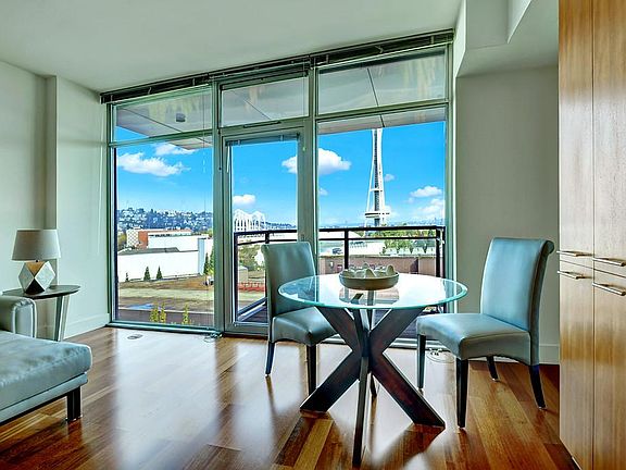 Above all nearby buildings, direct views of Queen Anne and the Space Needle.