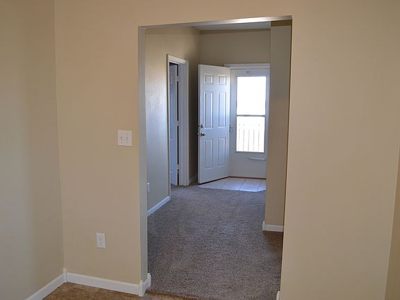from kitchen, 2 bedrooms off hall as well as side deck