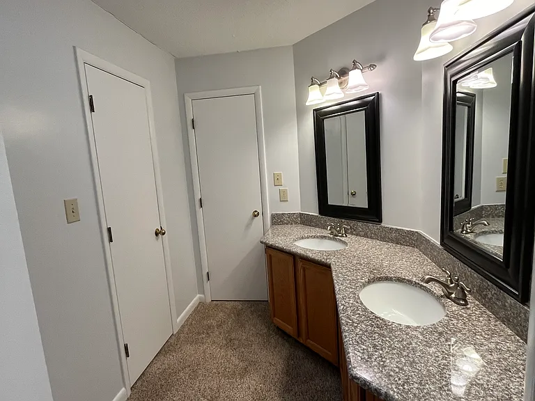 Bathroom with dual sink vanity.