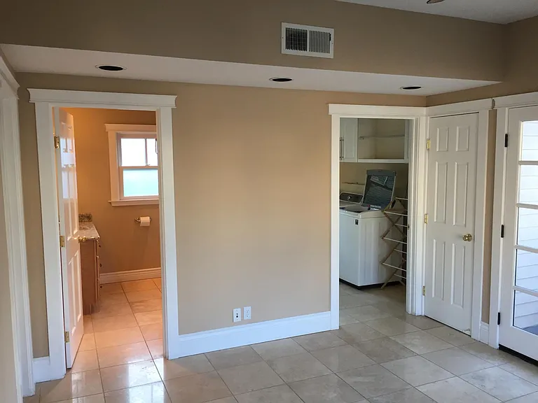 Family room looking at bath 3 and laundry room