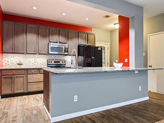 5th image of 4001 Tanglewilde St APT 404