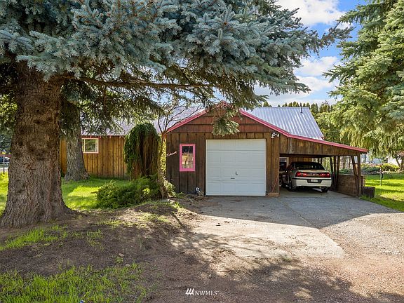 Attached garage as well as additional parking under the carport and in the driveway.