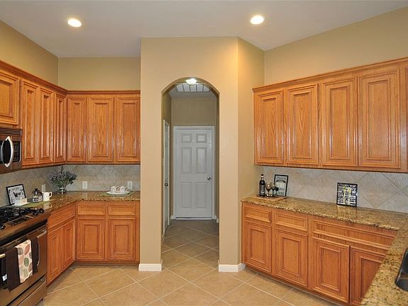 Spacious kitchen with plenty of cabinets for storage, granite countertop and stainless steel appliances to inspire the chef within!
