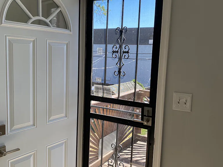 doors and transom to allow in light; storm door can be screen or glass depending on the season.